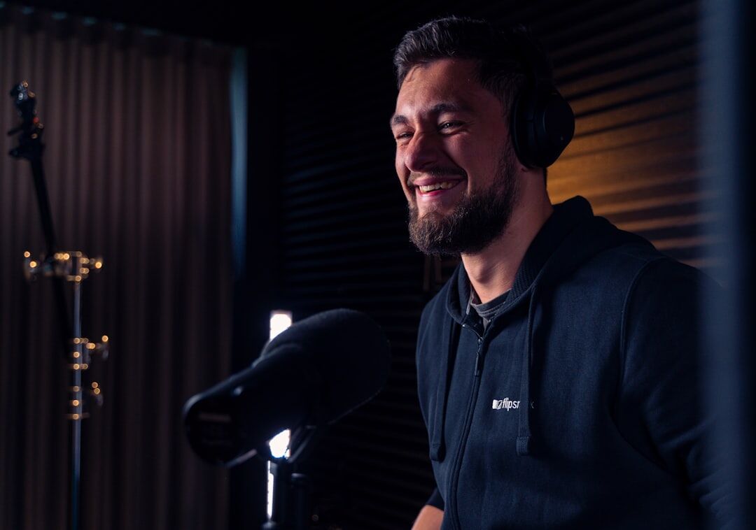 Finnish male broadcast instructor with headset in studio